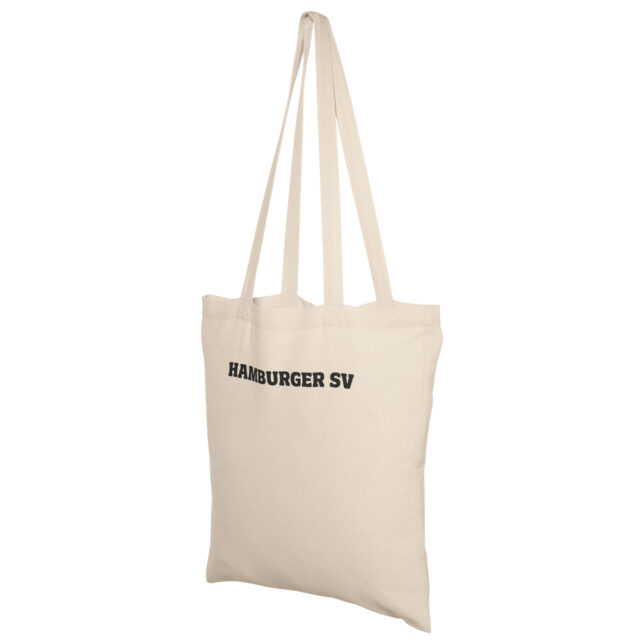 Das Bild zeigt einen cremefarbenen Jutebeutel mit der schwarzen Aufschrift „Hamburger SV“ aus dem HSV-Fanshop.
